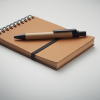 a notebook and pen on a white surface