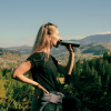Additional Thumbnail Image 8 - a woman with long hair holding a microphone