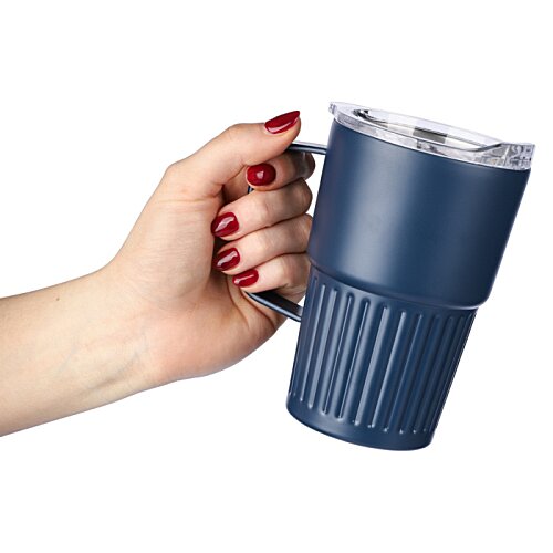 Additional Image 1 - a hand holding a blue cup