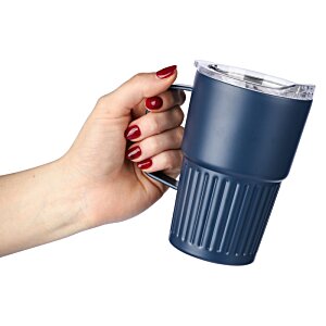 Additional Image 1 - a hand holding a blue cup
