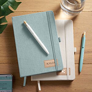 Additional Image 7 - a stack of notebooks and pen on a table