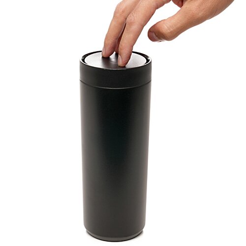 Additional Image 4 - a hand pushing a black cylinder