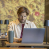 Additional Thumbnail Image 11 - a man sitting at a desk with a laptop