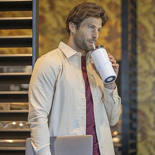 Additional Image 10 - a man holding a cup and looking away