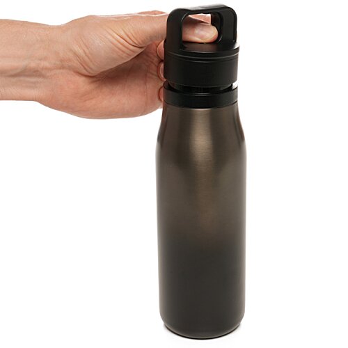 Additional Image 1 - a hand holding a bottle