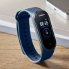 Additional Thumbnail Image 3 - a blue fitness tracker on a wood surface