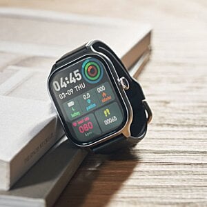 Additional Image 4 - a black watch with colorful buttons on it