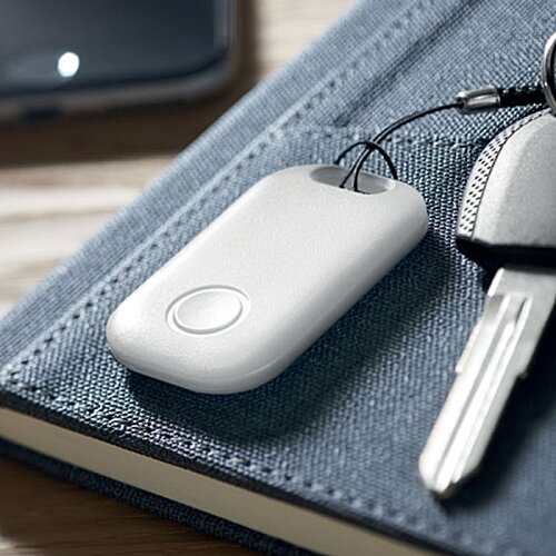 Additional Image 1 - a white device on a book