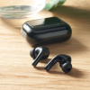 Additional Thumbnail Image 9 - a black earbuds on a wooden surface