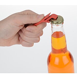Additional Image 5 - a hand holding a bottle cap