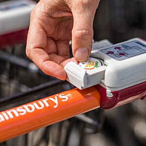 Additional Image 1 - a hand holding a button on a shopping cart