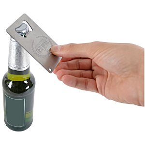 Additional Image 1 - a hand holding a card over a bottle
