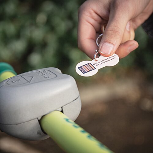 Additional Image 1 - a hand holding a key to a bike