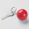 a key with a red ball