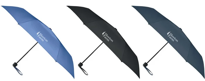 Three umbrellas side-by-side in different colours.
