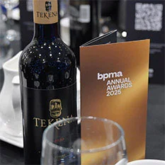 Wine bottle and brochure.