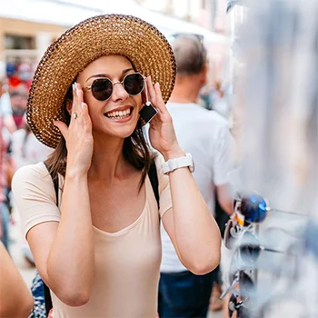 person putting sunglasses on.